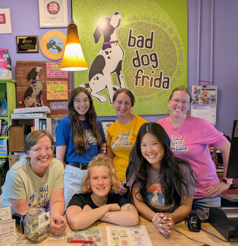 store staff in front of store