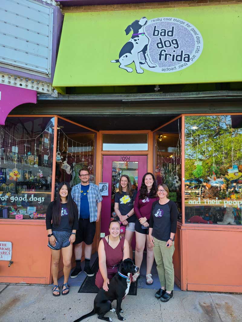 store staff in front of store